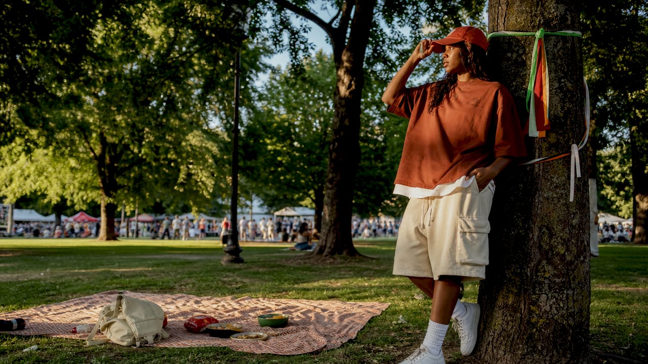 Young woman in oversized streetwear on city street
