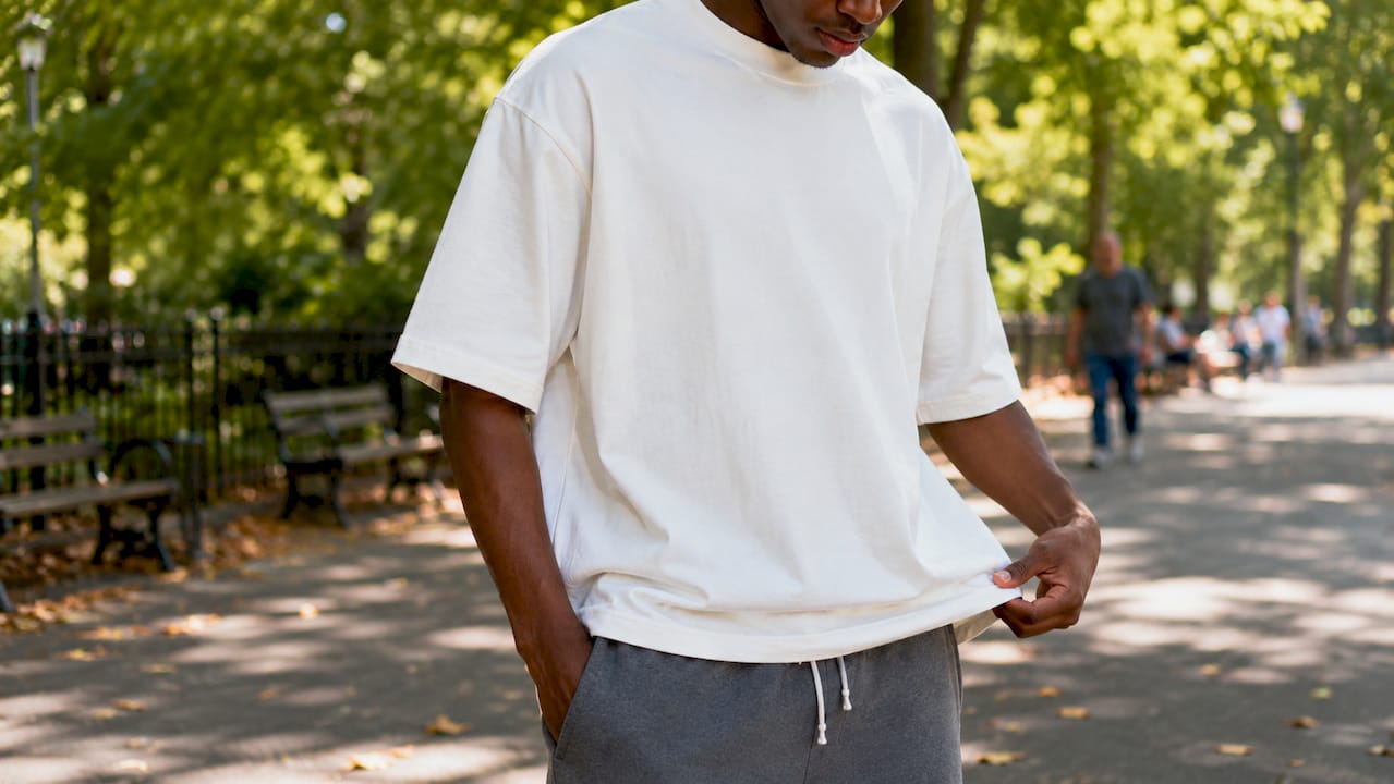 Man modeling oversized streetwear t-shirt outdoors