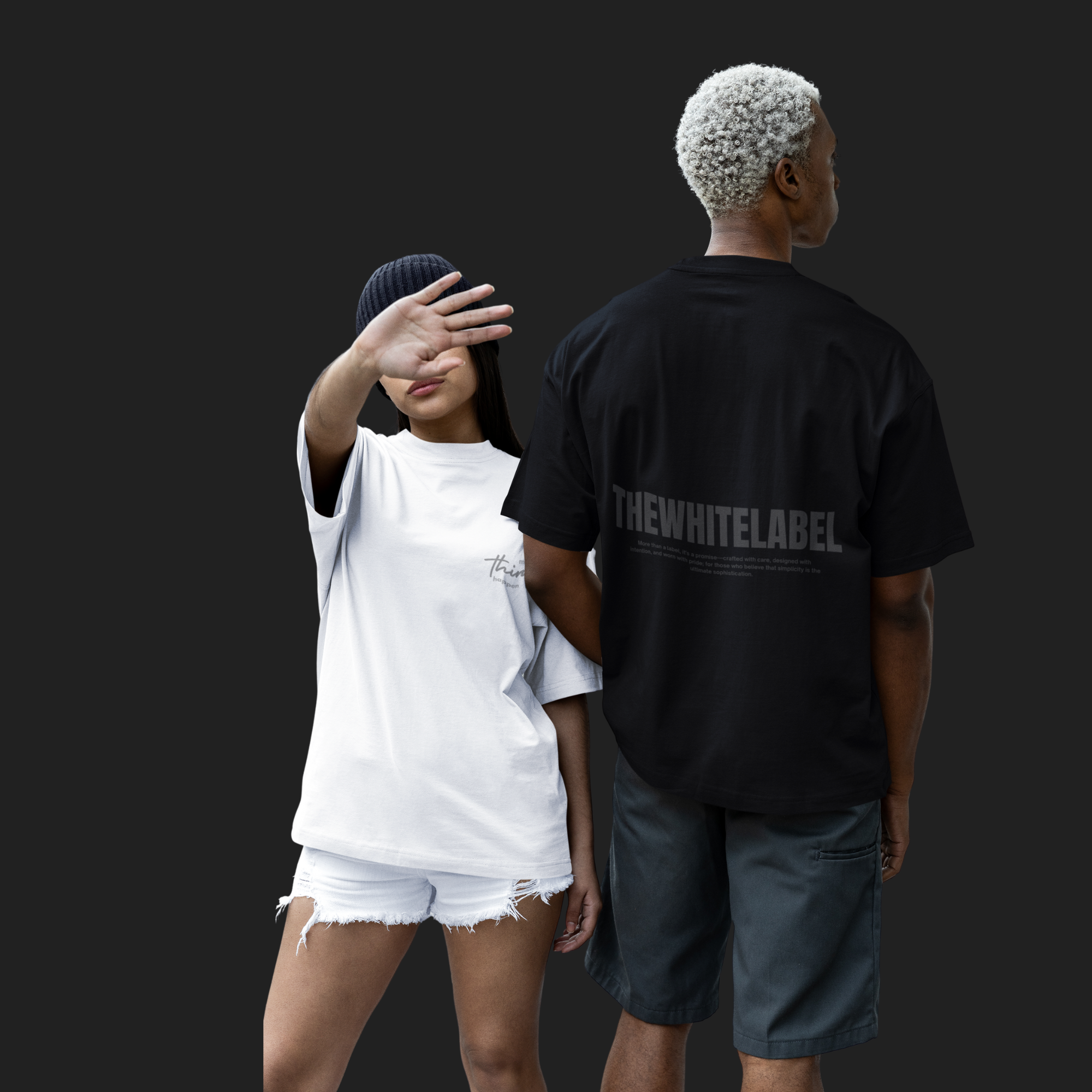 Two people, one covering their face with a white shirt and shorts, the other wearing a black 'THEWHITELABEL' shirt.
